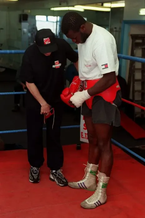 Framed Print : Herbie Hide Boxer putting on boxing gloves with his trainner Jim Mcdonnell