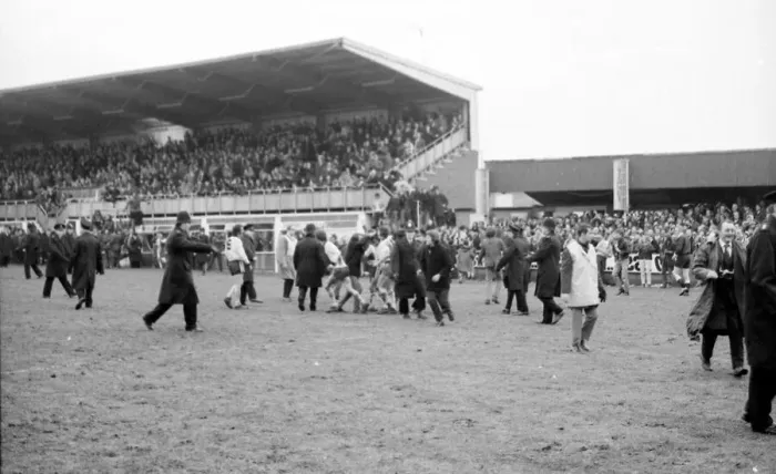 Framed Print : Hereford United fans celebrate by running on the pitch after second goal Hereford