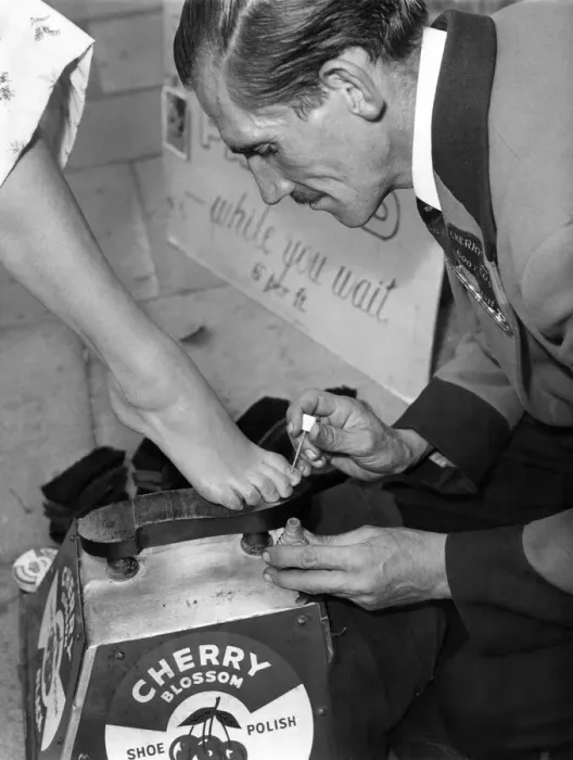 Framed Print : And heres a close-up of operation toe-shine. For a shilling a time shoe-shine Framed Print : And heres a close-up of operation toe-shine. For a shilling a time shoe-shine