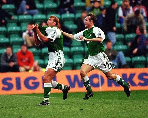Hibs versus Dundee October 1999 Grant Brebner rushes to salute Franck Sauzee after