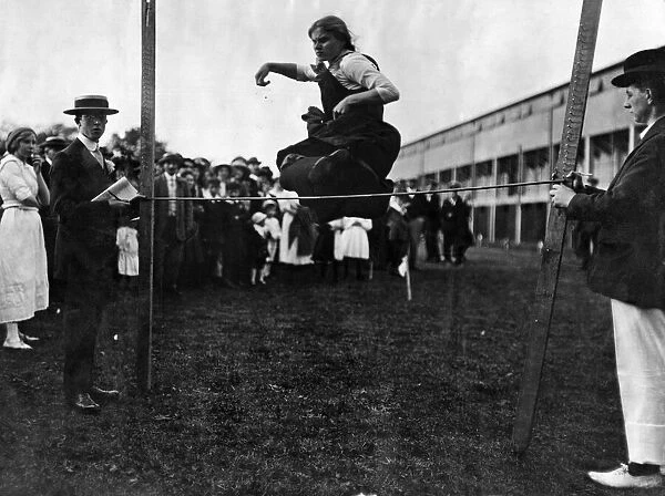 High jumping for girls at London sports event in connection with a garden-party