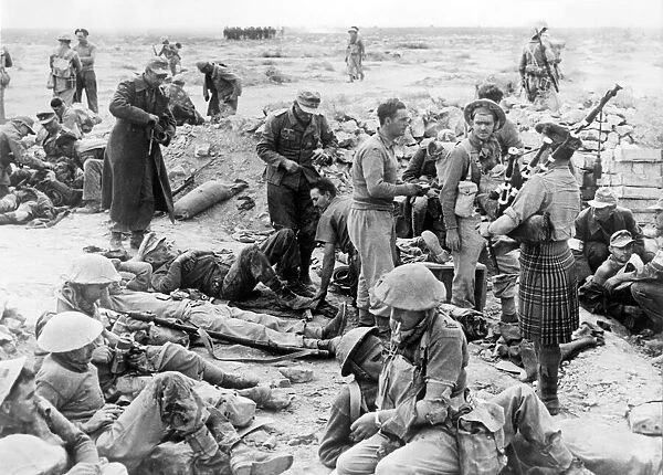 A Highland piper entertains wounded soldiers at a casualty clearing station during
