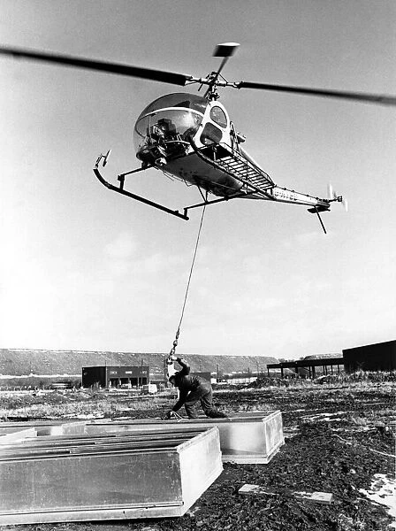 A Hiller UH-12 helicopter was called into lift 48 smoke ventilators onto the roof of a