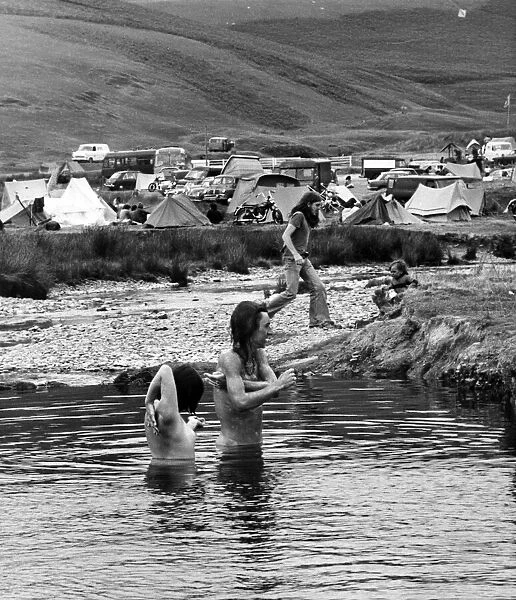 Hippies having a wash in some water. 7th July 1976