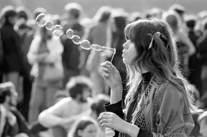 Framed Print : A hippy girl blowing bubbles at a pop concert in Hyde park, London June 1969