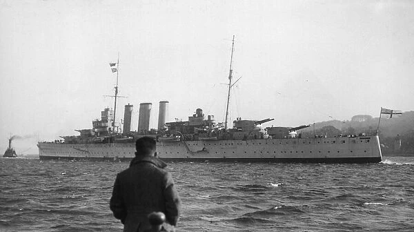 HMS Cornwall, pennant number 56, a County-class heavy cruiser seen here leaving Devonport