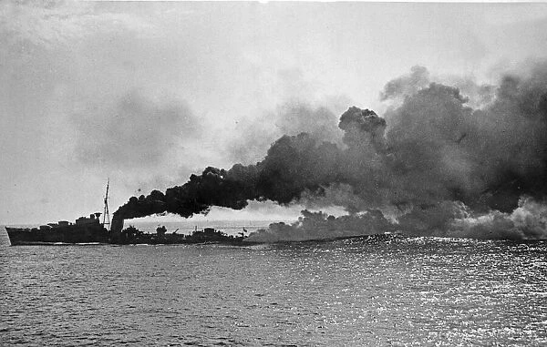 HMS Kelvin of the 5th Destroyer Flotilla, Home Fleet, lays a smoke screen during