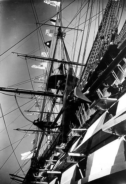 HMS Victory the flagship of the fleet flying signal flags for King George V Silver