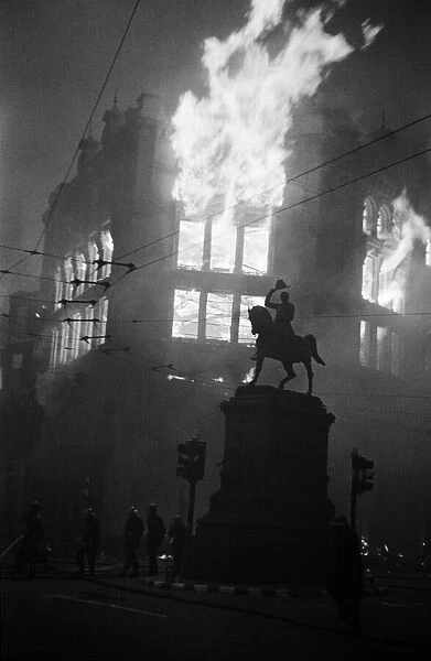 Holborn Circus ablaze after air raid, Statue of Prince Regent in the foreground