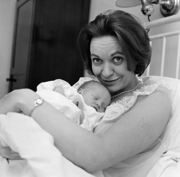 Framed Print : Holding her 12-hour old baby is stage and TV actress Lillias Walker Framed Print : Holding her 12-hour old baby is stage and TV actress Lillias Walker