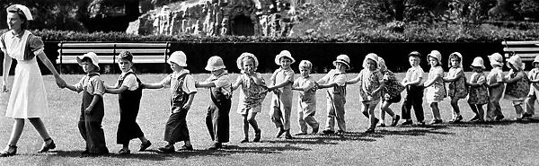 Holding the line. Youngsters from the Roxburgh Day Nursery at Clifton, Bristol