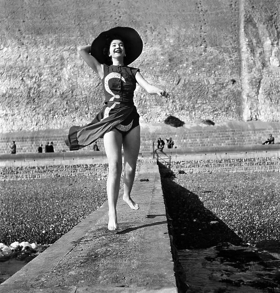 Holiday Fashion 1953 Christina Chandler models a coronation swimsuit