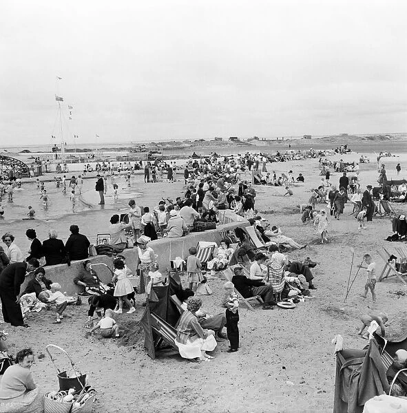 Holiday makers on Southport beach, Merseyside. 5th August 1959