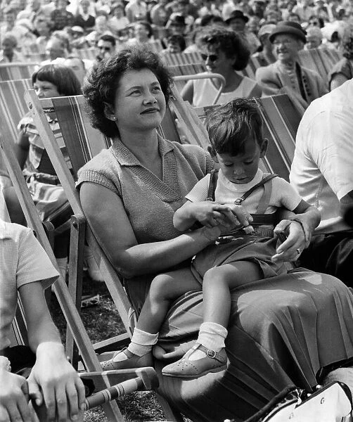 Holiday makers watching The Daily Mirror Beach fashion show. August 1959 P013224
