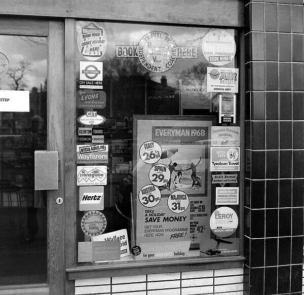 Holiday posters in shop window March 1968