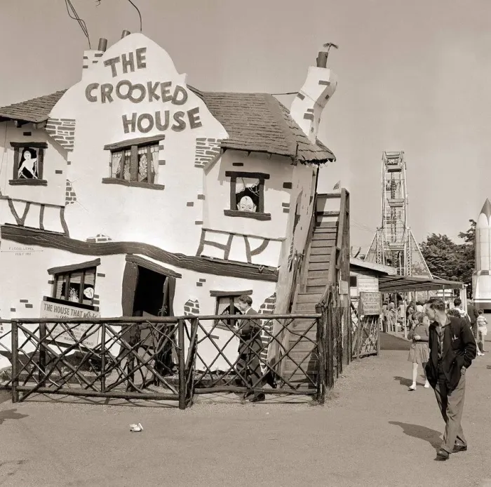 Framed Print : Holiday Resorts at Southend in Essex A man walks by a themed house called Framed Print : Holiday Resorts at Southend in Essex A man walks by a themed house called