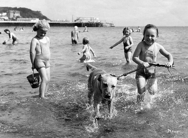 Holiday scene at Torquay. Susan Reeve with her dog. 31st May 1958