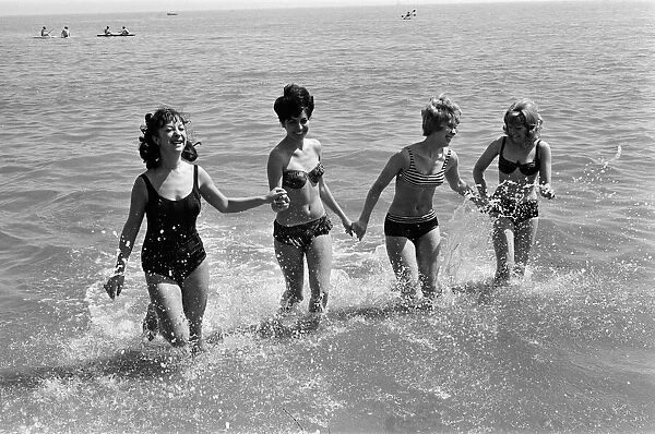 Holiday scenes in Brighton, East Sussex on the Whitsun bank holiday. 15th May 1964