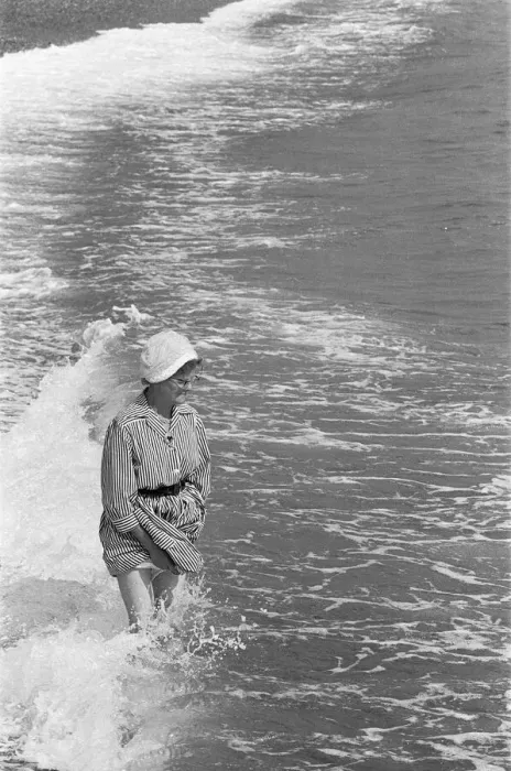 Framed Print : Holiday scenes at Brighton Elderly woman paddling in the sea holding her skirt up Framed Print : Holiday scenes at Brighton Elderly woman paddling in the sea holding her skirt up