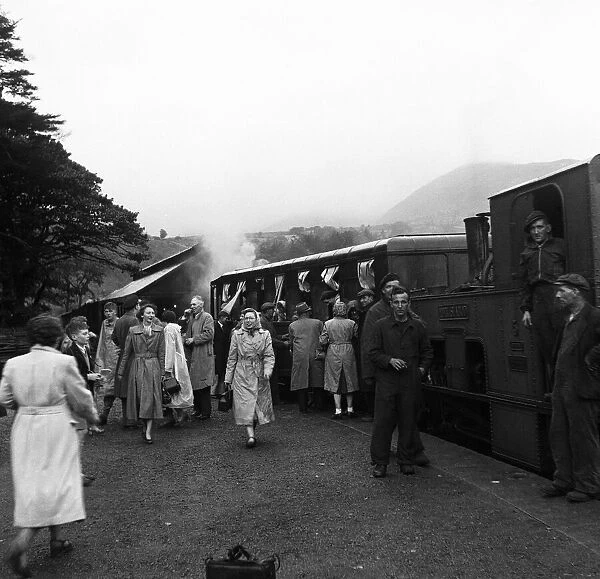 Holidaymakers board the steam train at the summit of Snowdon in Llanberis