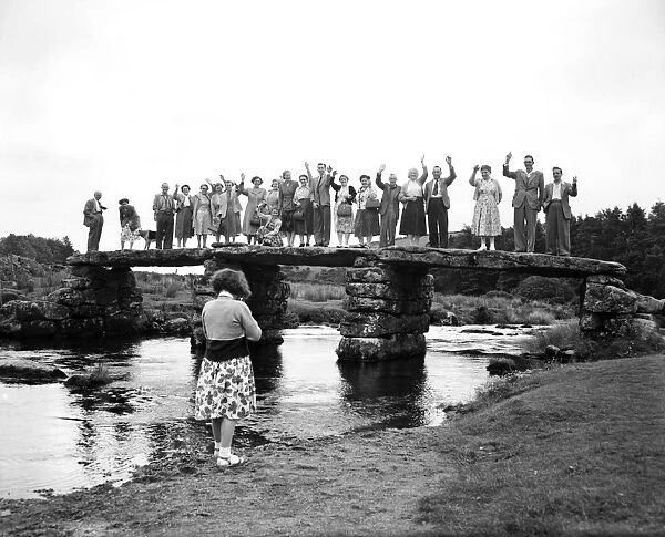 Holidaymakers on a Clapper Bridge (a bridge built of solid granite by ancient Britons