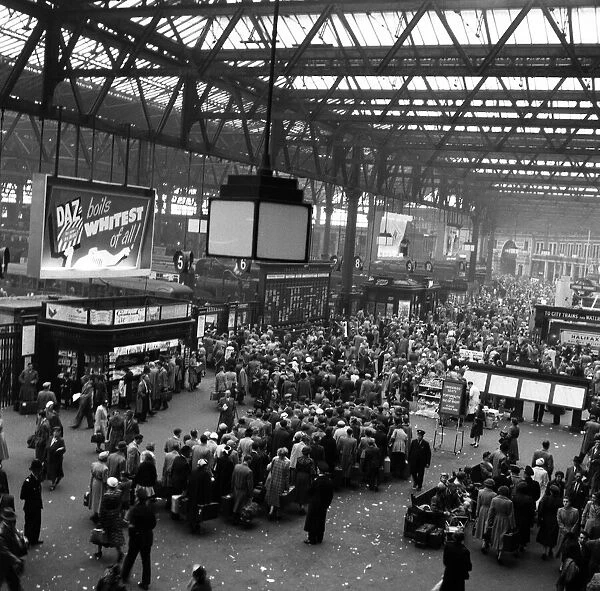 Holidaymakers leaving Waterloo Station, London. July 1954