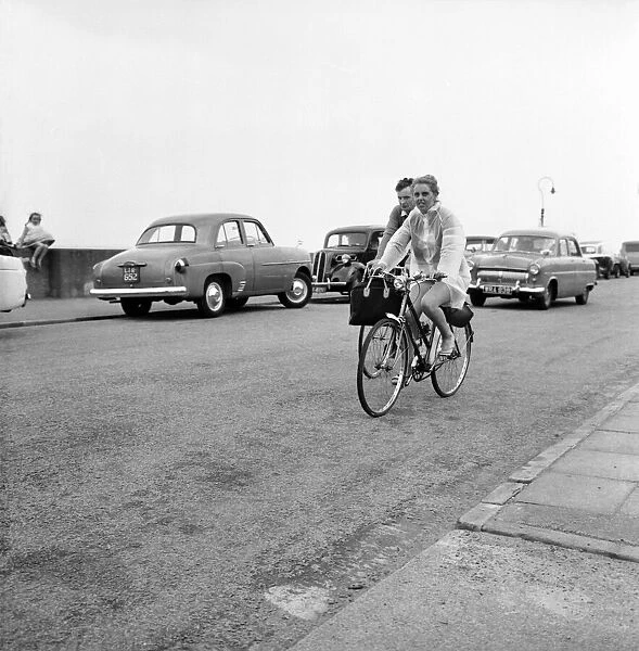 Holidaymakers riding along the sea front at Haylake Devon. June 1960 M4313-007