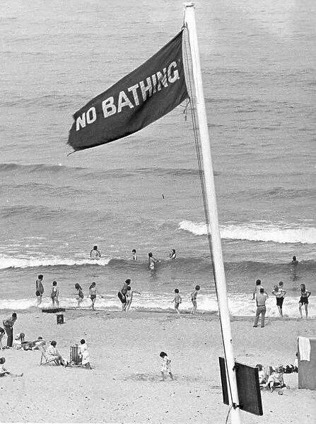 Holidaymakers risk their lives by ignoring the NO BATHING signs at this North East beach