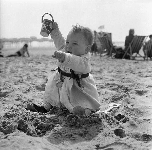 Holidays. 12 Months old Alison Smith enjoying the pleasures of the beach for the first