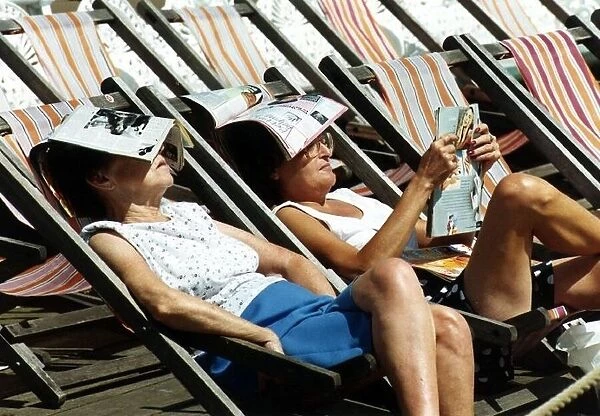 Holidays Blackpool couple sunbathe in deckchairs