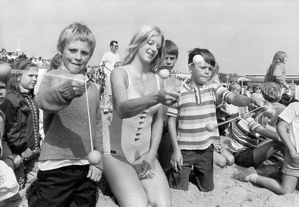 Holidays Children on the beach at Great Yarmouth with the knockers