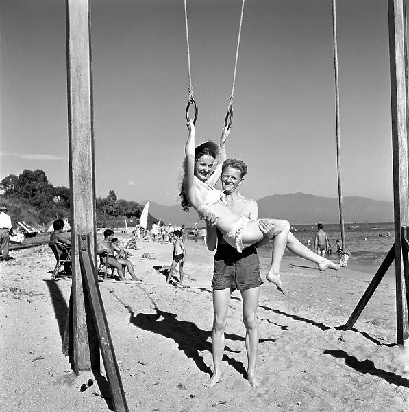 Holidays: Couples enjoying the beach on Corsica. August 1957 A503a-001