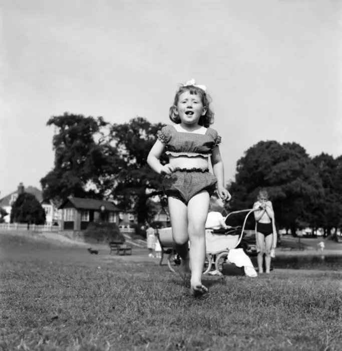 Framed Print : Holidays, little girl modelling swimsuit. June 1953 D3299-004 Framed Print : Holidays, little girl modelling swimsuit. June 1953 D3299-004