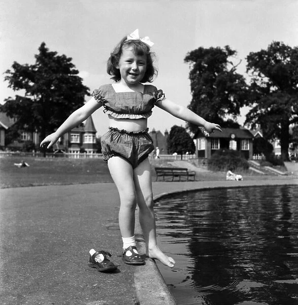 Holidays, little girl modelling swimsuit. June 1953 D3299
