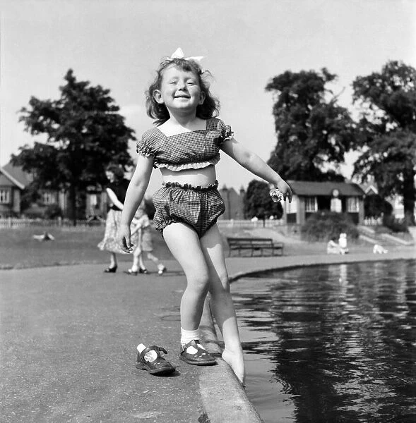 Holidays, little girl modelling swimsuit. June 1953 D3299-008