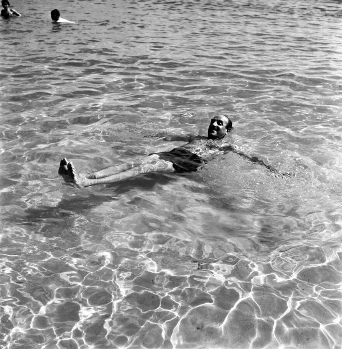 Framed Print : Holidays: Man enjoying the beach on Corsica. August 1957 A503a-009
