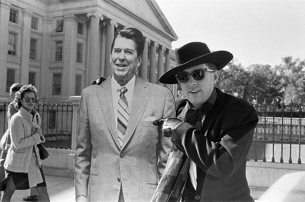 Holly Johnson posing outside the White House with a full-size cutout of Ronald Reagan