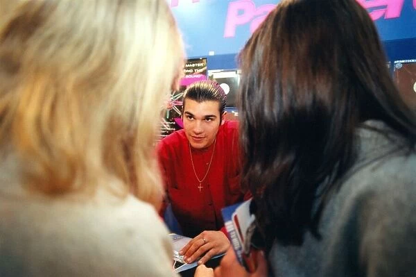 Home and Away actor Daniel Amalm siging copies of his CD in the HMV shop at
