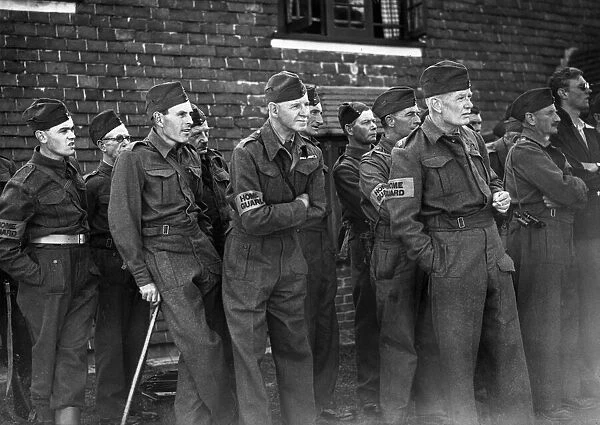 Home guards listen to their instructions before going out on patrol during the Second