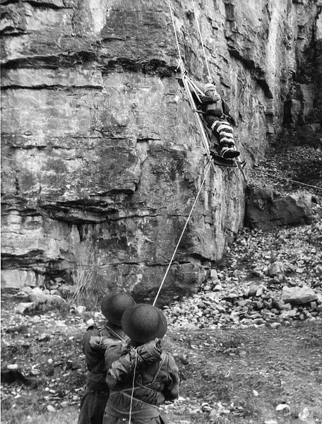 Home Guards in North Wales lowering a stretcher down a cliff face
