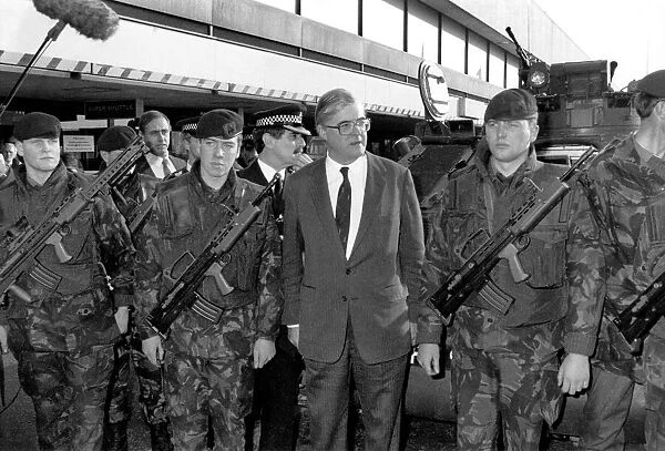 Home Secretary in the Conservative government Kenneth Baker inspecting troops