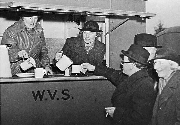 Home Secretary Herbert Morrison seen here being served with a cup of tea by W. V. S