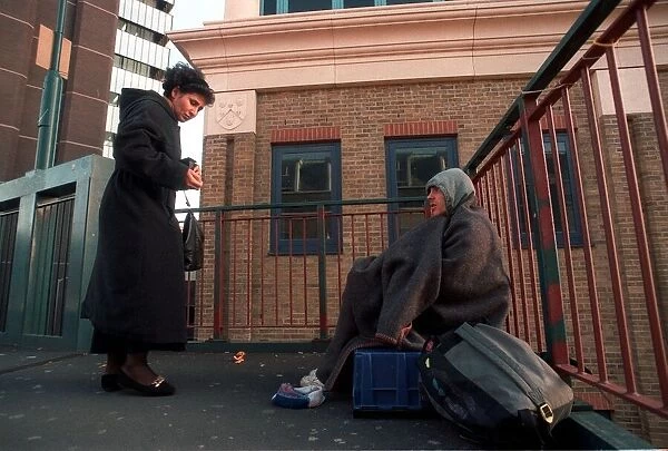 Homeless person begging near St Guys Hospital Extension