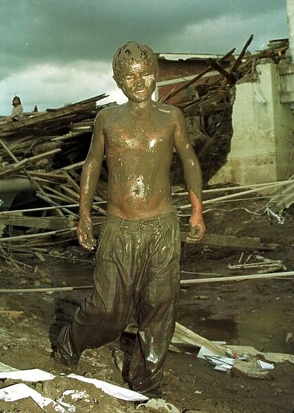 Honduras Hurricane Aftermath November 1998 Melvin boy aged 14 years old caked in