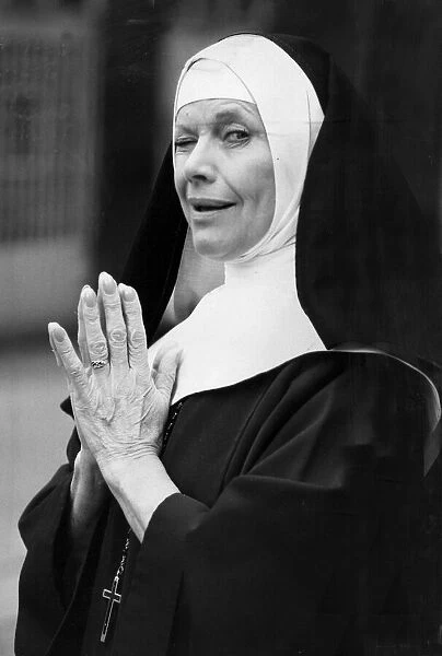 Honor Blackman dressed as a nun for photo call - February 1987