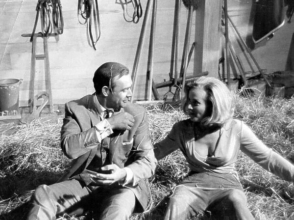 Honor Blackman and Sean Connery in haystack during filming of Goldfinger - June 1964