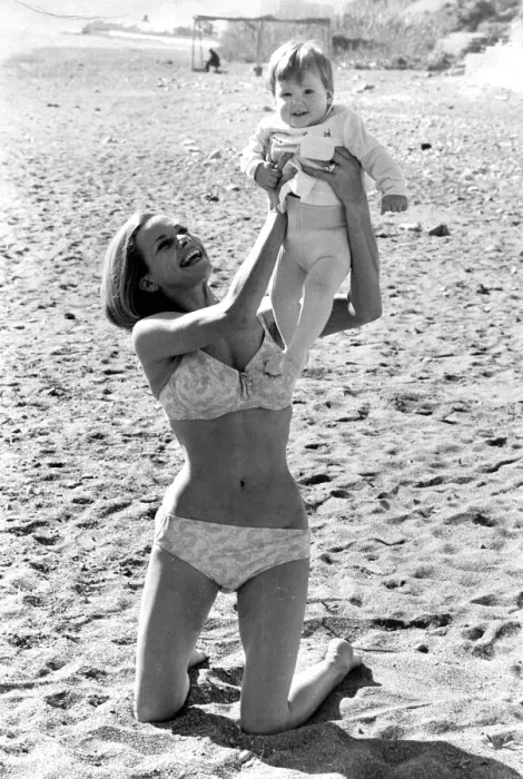 Framed Print : Honor Blackman wearing biini playing with daugher Lottie on beach in Spain during filming Framed Print : Honor Blackman wearing biini playing with daugher Lottie on beach in Spain during filming