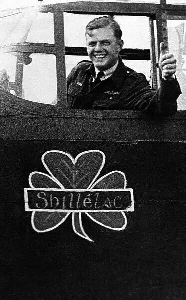 Honour For Ulster. RAF Pilot Noel waves from the cockpit of his Lancaster bomber