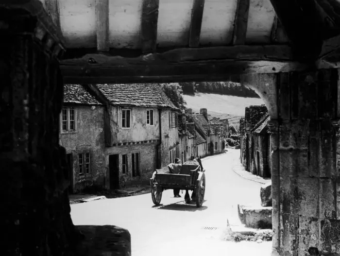 Framed Print : Horse drawn cart makes its way down a typical Cotswold village road in Gloucestershire Framed Print : Horse drawn cart makes its way down a typical Cotswold village road in Gloucestershire