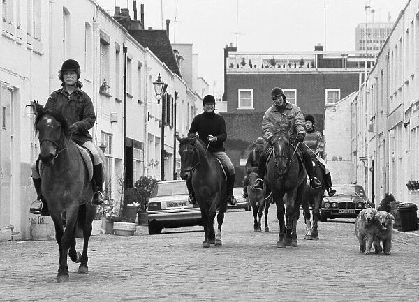 Horse riders in Hyde Park Gardens Mews on there way to the stables in Bathurst Mews